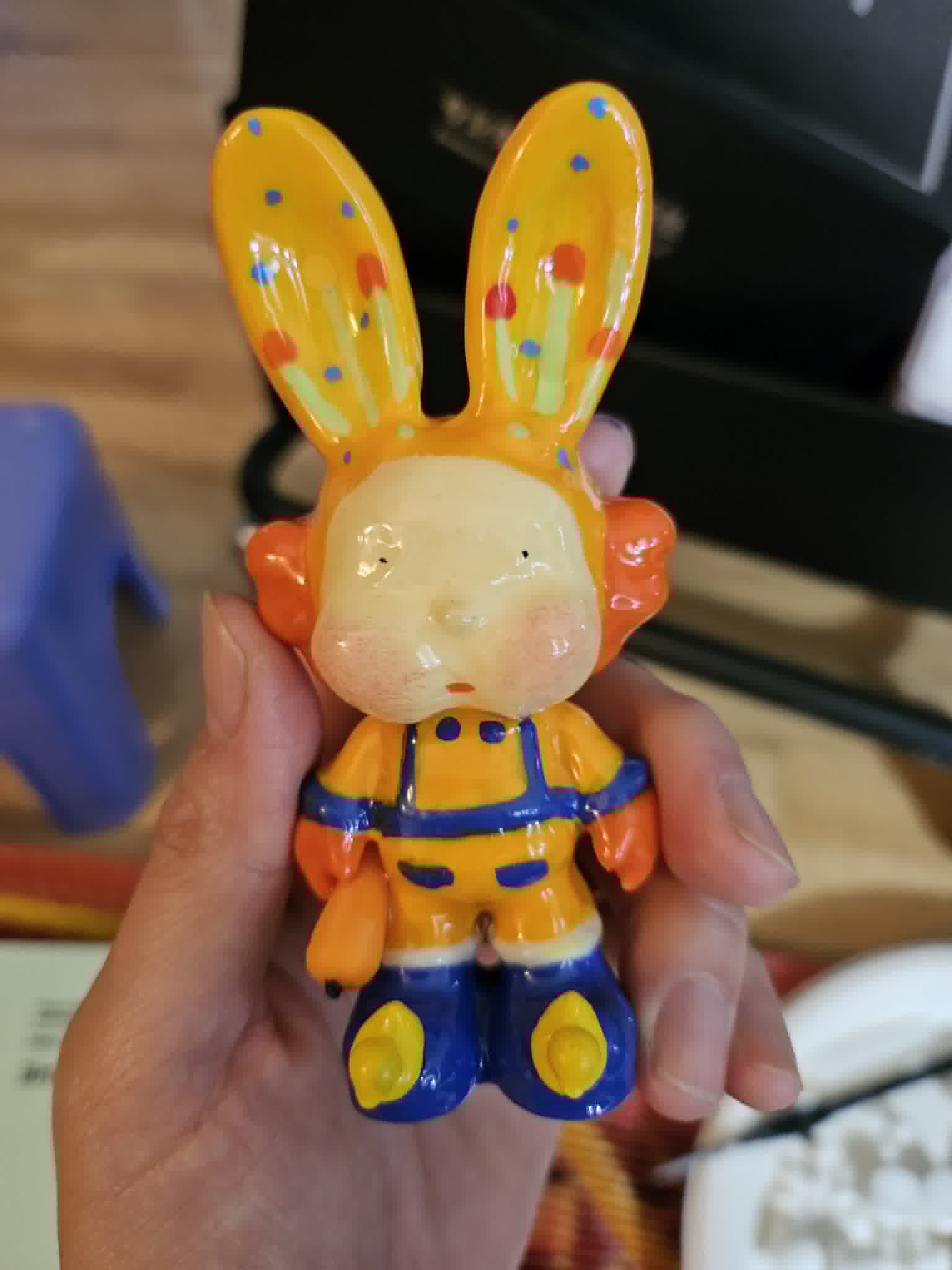 Hand-glazed painted bunny figurine in overalls